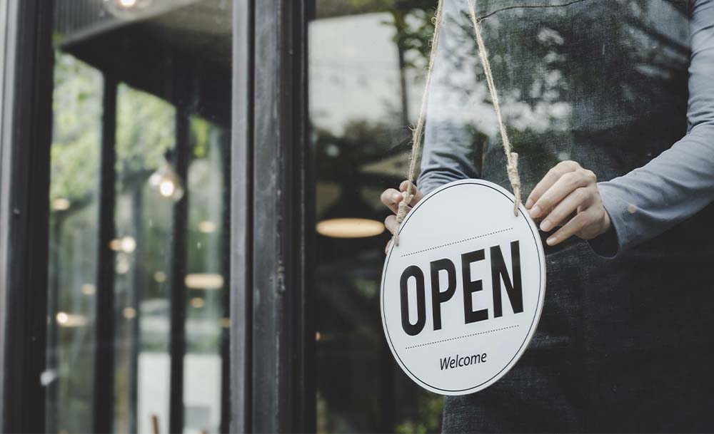 Store with an open sign awaiting for customers