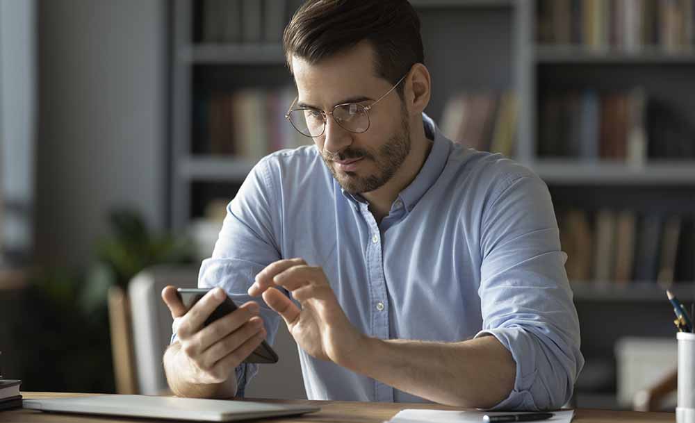 Man using and looking his smartphone