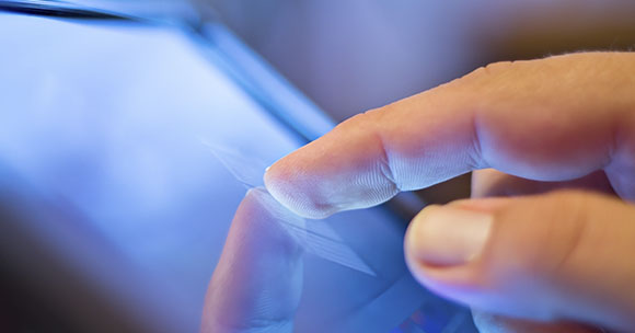 Person working on a tablet screen