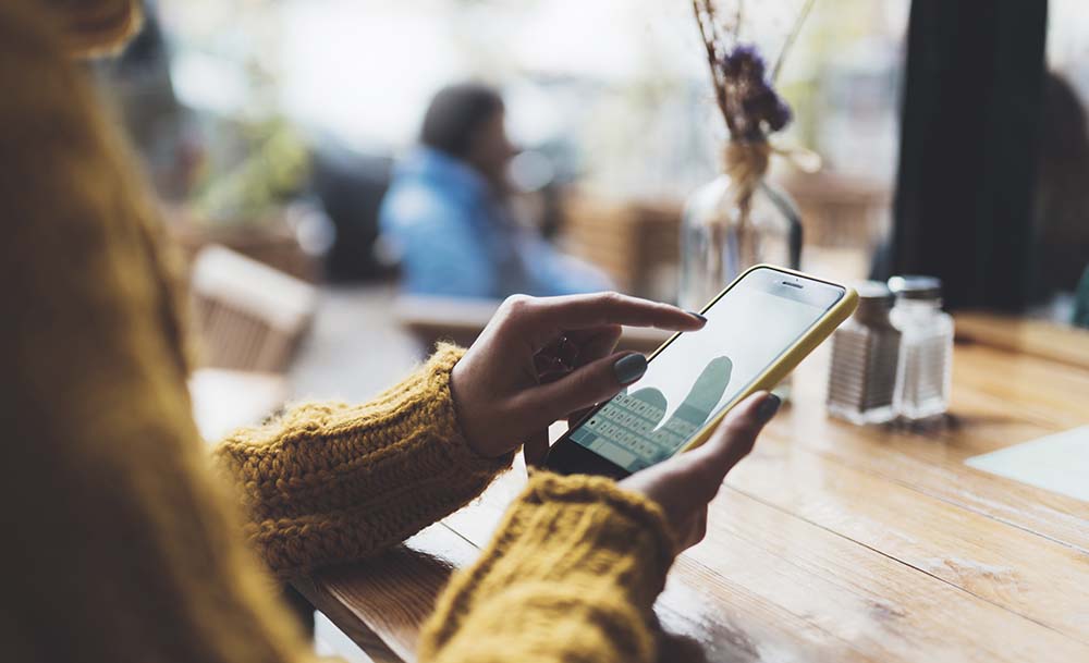 Woman consulting an app on her mobile