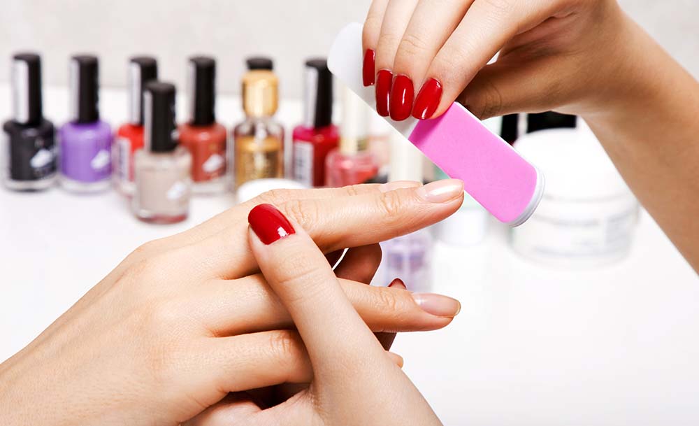 Manicure professional providing service to a customer