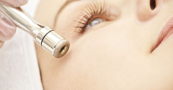 Beautician performs an eye treatment